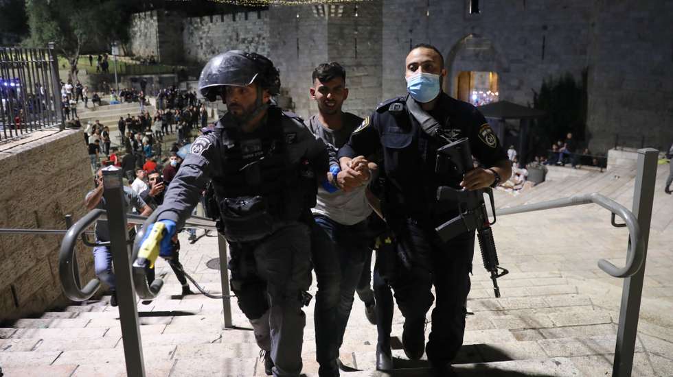 epa09183969 Israeli border police arrest a Palestinian protester during a protest supporting Palestinians families that face eviction from their homes at Sheikh Jarrah neighborhood in East Jerusalem, 07 May 2021. An Israeli court in East Jerusalem ordered the eviction of six Palestinian families from their homes in favor of Jewish families who claimed they used to live in the houses before fleeing in Israel's 1948 war for independence. The Palestinian residents filed an appeal and a final verdict is expected on 10 May.  EPA/ABIR SULTAN