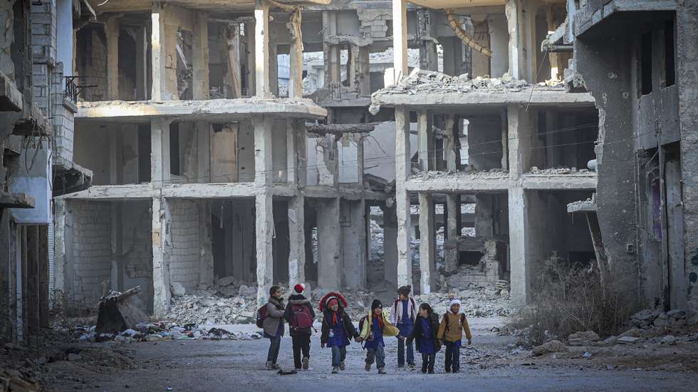 Set of 31 photographs of the Yarmouk refugee camp and distributed on 23 December 2024.
Children walk down a street of Yarmouk refugee camp, established in 1957 to accommodate Palestinian refugees who had fled the 1948 catastrophe and ethnic cleansing of Palestine, in Damascus, Syria, 19 December 2024. Yarmouk, on the southern outskirts of Damascus, was once known as the 'capital of the Palestinian diaspora', before the war in Syria reduced it to row after row of blasted out buildings where there were once falafel stands, pharmacies and mosques. ANTONIO PEDRO SANTOS/LUSA
