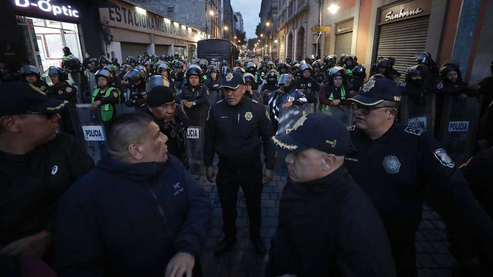 epa11597655 Police secure the area around the venue of XicohtÃ©ncatl where a session of the Senate Chamber was moved after disruption by protesters, in Mexico City, Mexico, 10 September 2024. A group of protesters, opposing judicial reforms in Mexico, burst into the senate amid aggression, trying to prevent the imminent approval by the ruling party of the election of judges by popular vote, while legislators moved to an alternate location to continue the legislative session.  EPA/Isaac Esquivel