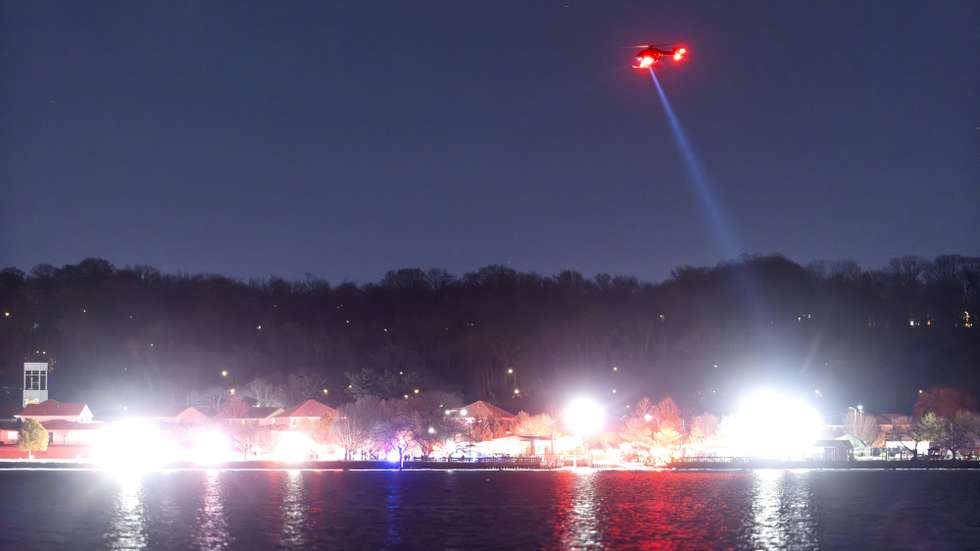 epa11862726 Rescue teams search the Potomac River after a commercial airplane reportedly collided with a military helicopter on approach to Ronald Reagan National Airport in Washington, DC, USA, 29 January 2025. According to a preliminary statement from the United States Federal Aviation Administration (FAA), a PSA Airlines Bombardier CRJ700 regional jet that departed earlier today from Wichita, Kansas collided in midair with a Sikorsky H-60 helicopter while on approach to Reagan Washington National Airport.  EPA/JIM LO SCALZO