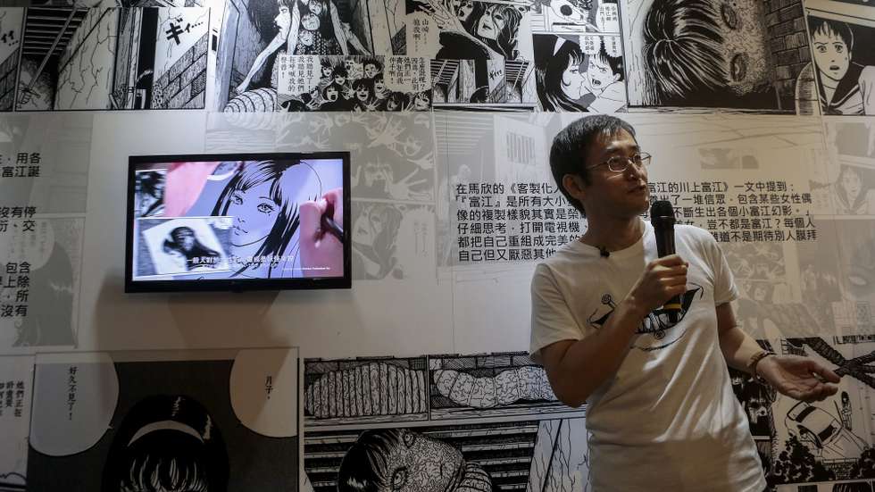 epa05052799 Japanese horror manga artist Junji Ito speaks to visitors during the ‘Experience Horror’ exhibition in Taipei, Taiwan, 03 December 2015. The exhibition is Junji Ito’s first personal on his career for nearly 30 years according to the organizer.  EPA/RITCHIE B. TONGO
