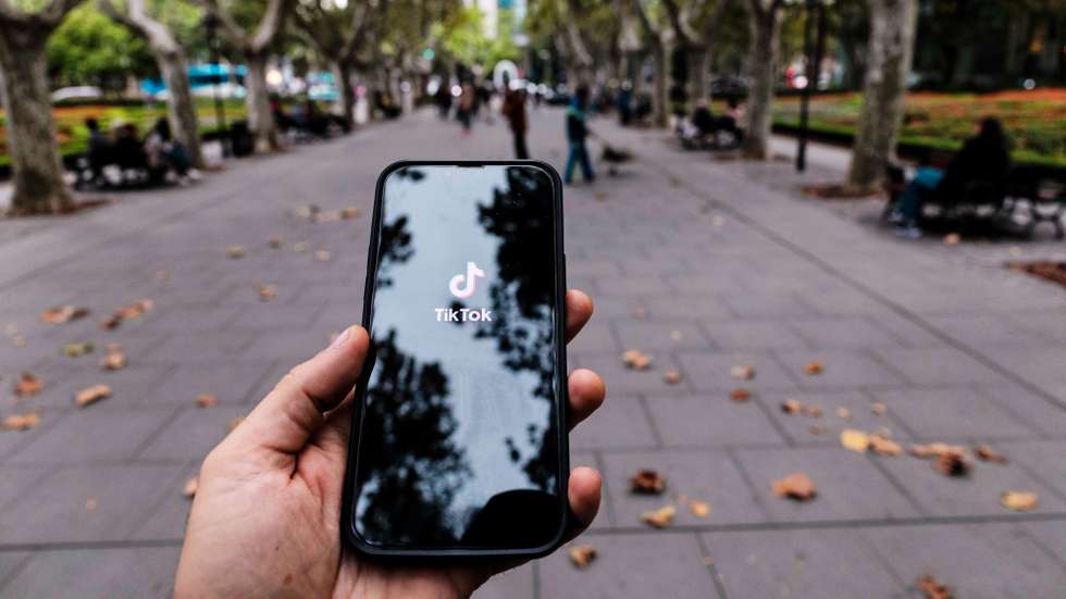 epa12494832 A phone showing the homescreen for the TikTok app is seen in Shanghai, China, 31 October 2025. U.S. Treasury Secretary Scott Bessent announced on 30 October 2025 that China has approved the transfer agreement for the social media app TikTok.  EPA/ALEX PLAVEVSKI