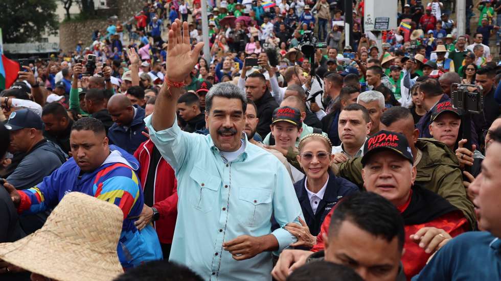 epa12583973 Venezuelan President Nicolas Maduro (C) participates in a demonstration organized by the United Socialist Party of Venezuela (PSUV) in Caracas, Venezuela, 10 December 2025. While government supporters rallied in the streets, opposition leader Maria Corina Machado, prevented from running for office by President Nicolas Maduro's administration, was awarded the 2025 Nobel Peace Prize in today’s ceremony in Oslo.  EPA/MIGUEL GUTIERREZ