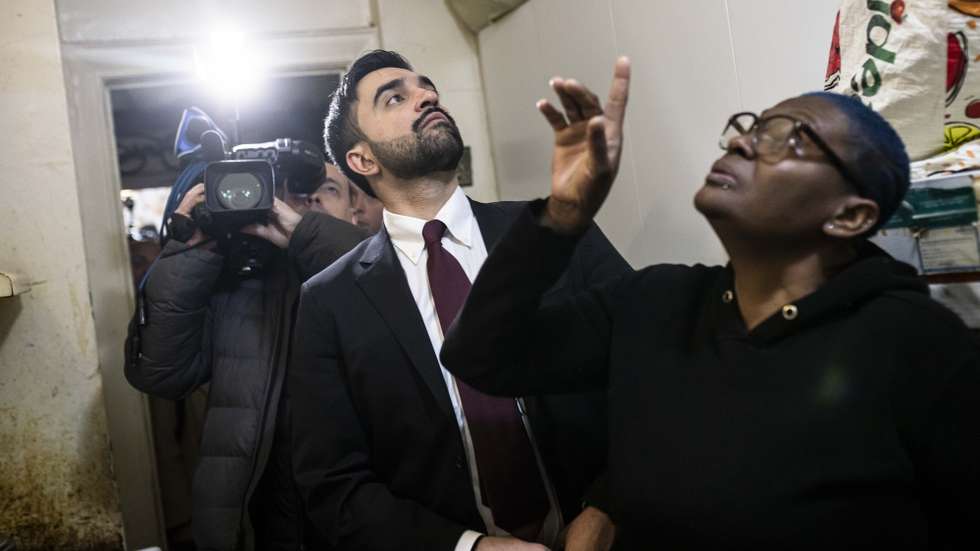 epa12621243 New York City Mayor Zohran Mamdani visits an apartment belonging to Nadege Romulus (R) on his first day in office, in the Prospect Lefferts Garden neighborhood of Brooklyn, New York, USA, 01 January 2026.  EPA/Dave Sanders / POOL