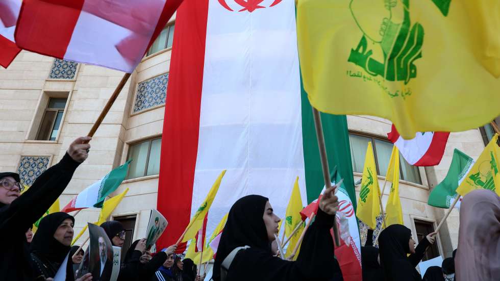epa12907231 Hezbollah supporters wave Lebanese, Iranian and Hezbollah flags during a commemorative  rally for the slain Iranian Supreme Leader Ali Khamenei under the slogan 'The Stand of Loyalty and Devotion', amid a fragile ceasefire between Israel and Lebanon, in Beirut, Lebanon, 22 April 2026. Khamenei was killed in a series of US and Israeli airstrikes in Tehran on 28 February 2026.  EPA/WAEL HAMZEH