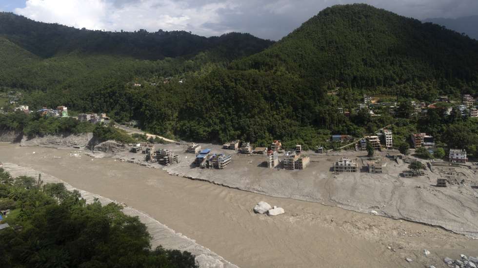 epa13196821 An aerial view shows an area devastated by flash floods and mudslides in Delight village, Nuwakot district, Nepal, 28 August 2026. More than 460 people have died and hundreds remain missing across northern Nepal after a suspected glacial collapse and avalanche triggered flash floods and mudslides along the Bhotekoshi and Trishuli river valleys near the Nepal-Tibet border, causing widespread destruction to settlements and infrastructure, according to local authorities.  EPA/NARENDRA SHRESTHA