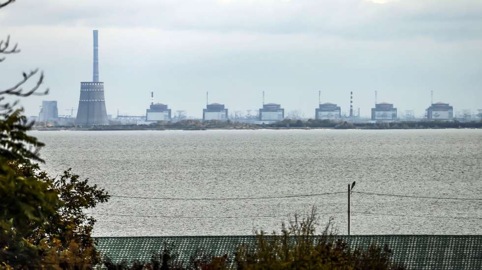 epa10271118 The Zaporizhzhia nuclear power plant (ZNPP) is seen from Nikopol, Ukraine, 28 October 2022. According to a statement by IAEA director general chief Grossi from 28 October 2022, engineers at the ZNPP have been working to stabilize the facility’s external power supplies. The plant has received the power needed to cool the reactors "directly and without interruption from the national grid," the nuclear watchdog's chief said. Russian troops on 24 February entered Ukrainian territory, starting a conflict that has provoked destruction and a humanitarian crisis.  EPA/HANNIBAL HANSCHKE