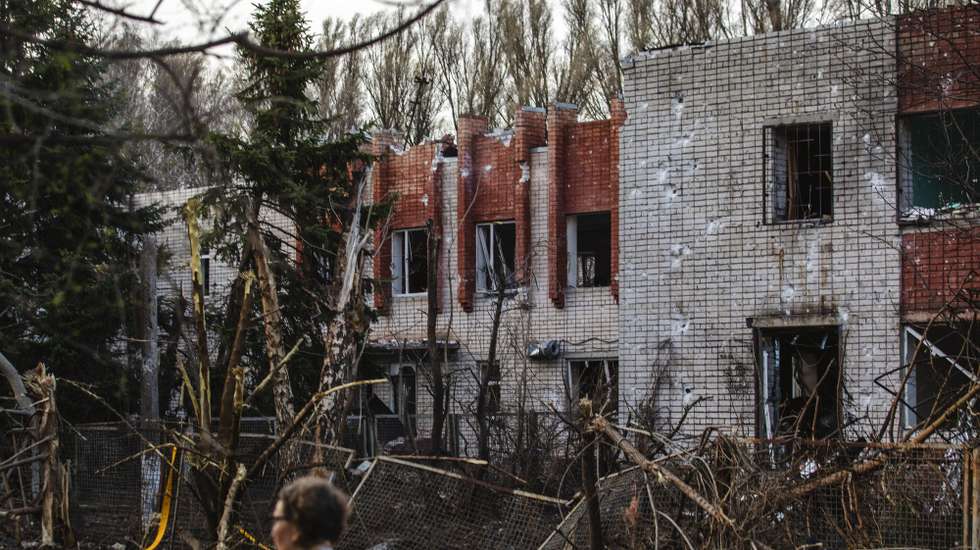 epa11255784 A woman walks past the site of a rocket attack on a kindergarten in the city of Dnipro, Dnipropetrovsk region, southeastern Ukraine, 02 April 2024, amid the Russian invasion. At least 13 people were injured in Dnipro, including five children, as a result of the rocket attack on an educational institution and kindergarten building, according to the State Emergency Service.  EPA/ARSEN DZODZAIEV 48547