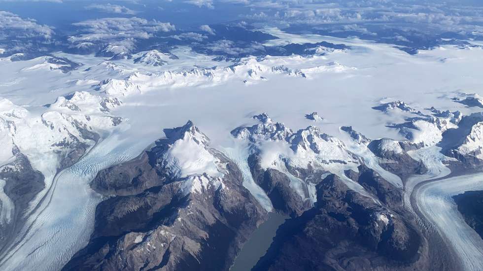 epa10539653 An aerial photograph shows the Darwin mountain range, which counts among the highest concentration of glaciers in the world, in Alberto de Agostini National Park on the island Isla Grande de Tierra del Fuego, Chile, 23 March 2023. Greenpeace warned on 22 March, World Water Day, that Chile faces an almost irreversible climate crisis due to global warming and the accelerated loss of glacial mass.  EPA/Javier Martin