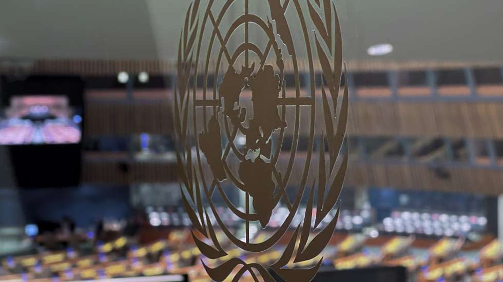 epa09778982 The United Nations logo is backdropped by the General Assembly hall as members prepare to meet on the conflict situation in the Eastern Ukraine, at the United Nations headquarters in New​ York, New York, USA, 23 February 2022. Russia on 21 February 2022 recognised the eastern Ukrainian self-proclaimed breakaway regions as independent states and ordered the deployment of peacekeeping troops to the Donbas, triggering an expected series of economic sanctions announcements by Western countries. The self-proclaimed Donetsk People's Republic (DNR) and Luhansk People's Republic (LNR) declared independence in 2014 amid an armed conflict in the eastern Ukraine.  EPA/JASON SZENES