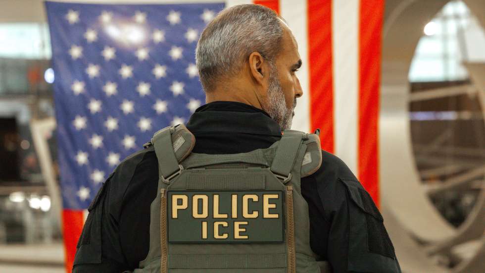 epa12844849 A US Immigration and Customs Enforcement (ICE) agent patrols the John F. Kennedy International Airport, amid congestion caused by the Department of Homeland Security (DHS) shutdown, in the Queens borough of New York, New York, USA, 23 March 2026. ICE agents have begun deploying to major US airports to assist the Transportation Security Administration (TSA) as a partial government shutdown triggers widespread security checkpoint delays. With the Department of Homeland Security (DHS) facing a funding lapse, TSA screeners and thousands of other federal employees are currently working without pay.  EPA/OLGA FEDOROVA