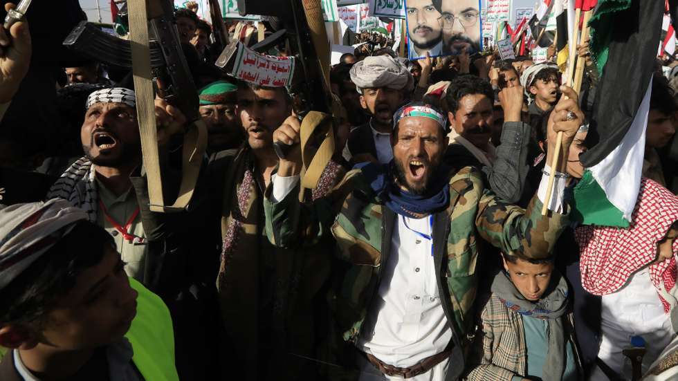 epa11071824 People shout slogans and hold up weapons during a protest against a multinational operation to safeguard Red Sea shipping following US and UK airstrikes on Houthis military sites, in Sana'a, Yemen, 12 January 2024. According to the Houthis military spokesman Yahya Sarea, five Houthi fighters were killed and six others wounded in a total of 73 airstrikes carried out by the United States and the United Kingdom against several Houthis-controlled sites in Yemen in response to Houthis attacks in the Red Sea. The US Department of Defense had announced in December 2023 a multinational operation to safeguard trade and to protect ships in the Red Sea amid the recent escalation in Houthi attacks. Houthis vowed to attack Israeli-bound ships and prevent them from navigating in the Red Sea and the Bab al-Mandab Strait in retaliation for Israel's airstrikes on the Gaza Strip, according to Sarea.  EPA/YAHYA ARHAB
