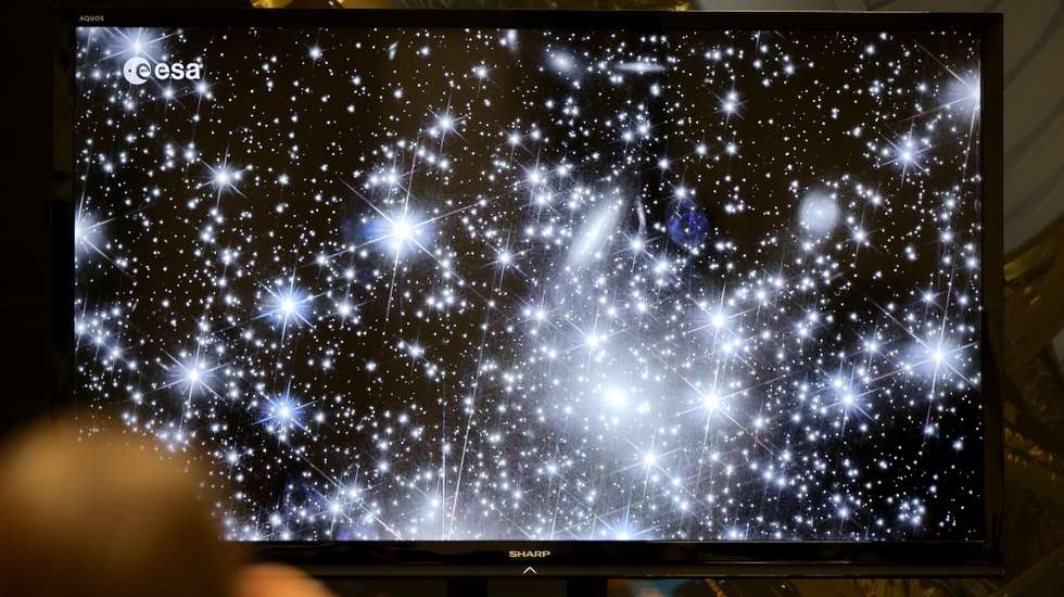epa10962443 A image taken by the Euclid space telescope show’s a color picture of a part of the Milky way Galaxy with thousands of stars and Galaxy’s at the European Space Operations Centre (ESA/ESOC) in Darmstadt, Germany, 07 November 2023. ESA's Euclid space telescope is designed to study the composition and evolution of the dark universe.  EPA/RONALD WITTEK