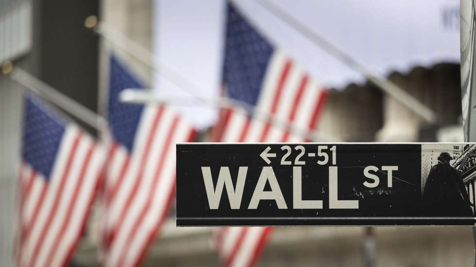 epa08839491 (FILE) - A sign for Wall Street outside of the New York Stock Exchange in New York, New York, USA, 28 October 2020 (reissued 24 November 2020). For the first time in its history, the US stock market index Dow Jones has risen above 30,000 points.  EPA/JUSTIN LANE