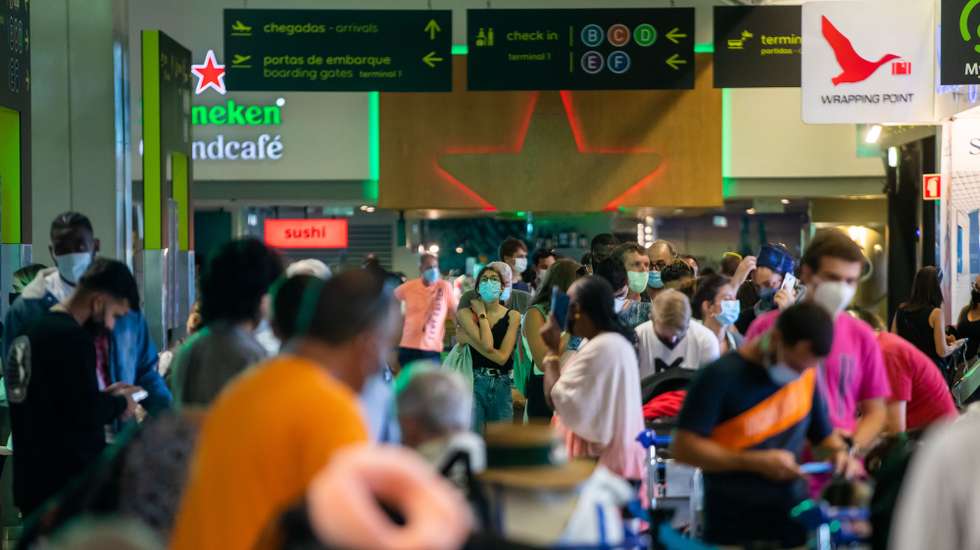 Passengers wait hours in long lines for their flight due to a strike of the handling company, Groundforce, which is causing major disruption in the Lisbon Airport, causing the cancelation of dozens of flights, in Lisbon, Portugal, 17 July 2021. Groundforce workers are protesting against colective dismissal of workers and low salaries. JOSE SENA GOULAO/LUSA