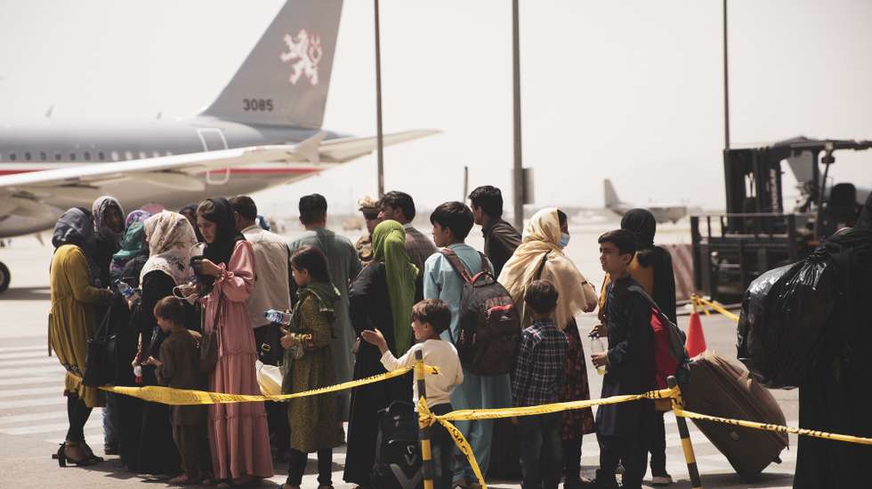 epa09421074 A handout photo made available by US Central Command Public Affairs shows civilians preparing to board a plane during an evacuation at Hamid Karzai International Airport, Kabul, Afghanistan, 18 August 2021 (issued 19 August 2021). US Marines are assisting the Department of State with an orderly drawdown of designated personnel in Afghanistan. (U.S. Marine Corps photo by Staff Sgt. Victor Mancilla) EPA/Staff Sgt. Victor Mancilla/ US Central Command Public Affairs HO Released By:LT Robert MookPublic Affairs OfficerJoint Task Force-Crisis Responserobert.e.mook2.mil@mail.mil HANDOUT EDITORIAL USE ONLY/NO SALES