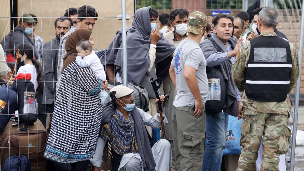 epa09436904 Evacuees from Afghanistan wait at the US Air Base in Ramstein, Germany, 30 August 2021. Ramstein Air Base is serving as major hub in the operation to evacuate people from Afghanistan, as the site is the world's largest US air force base outside the United States of America.  As part of Operation Allies Refuge, evacuees will receive support such as temporary lodging, food and water and access to medical care as well as religious care at Ramstein Air Base while preparing for onward movements to their final destinations. This operation is facilitating the quick, safe evacuation of US citizens, Special Immigrant Visa applicants, and other at-risk Afghans from Afghanistan.  EPA/RONALD WITTEK