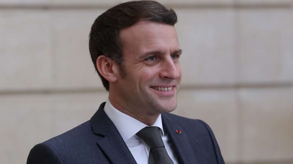 epa08989337 French President Emmanuel Macron smiles after a German-French Security Council video conference with German Chancellor Angela Merkel at the Elysee Palace in Paris, France, 05 February 2021.  EPA/THIBAULT CAMUS / POOL MAXPPP OUT