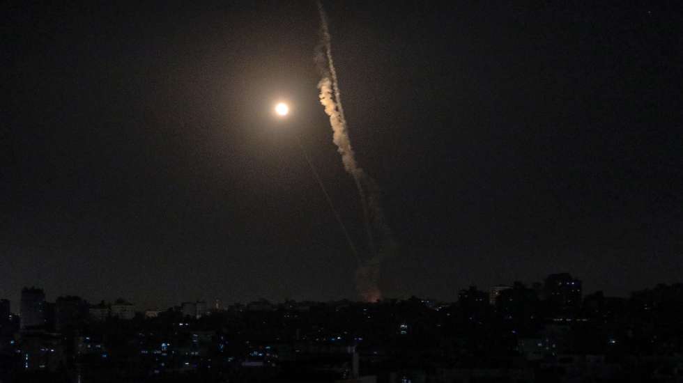 epa09210653 A rocket fired from Gaza flies towards Israel, in Gaza City, 18 May 2021. In response to days of violent confrontations between Israeli security forces and Palestinians in Jerusalem, various Palestinian militants factions in Gaza launched rocket attacks since 10 May that killed at least 12 Israelis to date. The Palestinian health ministry said that at least 213 Palestinians, including 61 children, were killed in the retaliatory Israeli airstrikes.  EPA/MOHAMMED SABER