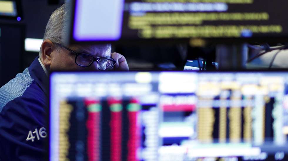 epa08283547 A Trader works on the floor of the New York Stock Exchange in New York, New York, USA, 10 March 2020. The Dow Jones Industrial closed down over 2000 points yesterday but partially recovered in early trading, as investors around the world are continuing to gauge the economic impact of the coronavirus.  EPA/JUSTIN LANE
