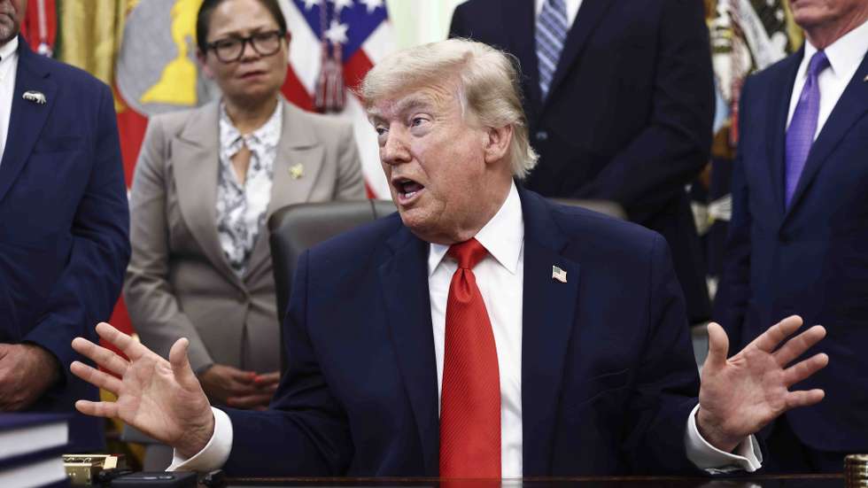 epa13031440 US President Donald Trump responds to a question from the news media after signing a fisheries proclamation in the Oval Office of the White House in Washington, DC, USA, 11 June 2026. Trump signed a proclamation opening parts of the Pacific to commercial fishing access for US-flagged vessels.  EPA/JIM LO SCALZO / POOL