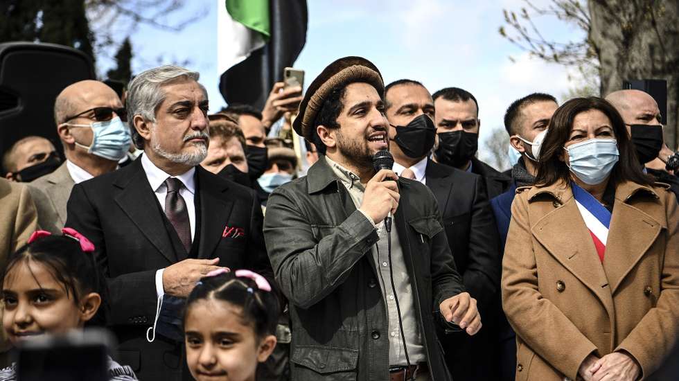 epa09101012 Ahmad Massoud (C), son of late Afghan commander Ahmad Shah Massoud, flanked by Paris Mayor Anne Hidalgo (R) and Chairman of Afghanistan's High Council for National Reconciliation Abdullah Abdullah (L), addresses supporters on the sidelines of a ceremony to unveil a commemorative plaque in honour of late Afghan anti-Taliban commander Massoud in an alley along the Champs-Elysees Avenue in Paris, France, 27 March 2021.  EPA/CHRISTOPHE ARCHAMBAULT / POOL  MAXPPP OUT