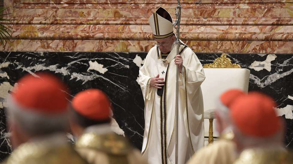 epa09114558 A handout picture provided by the Vatican Media shows Pope Francis (C) celebrating  the Easter Vigil in a near empty St. Peter's Basilica as coronavirus disease (COVID-19) restrictions stay in place for a second year running, at the Vatican, 03 April 2021.  EPA/VATICAN MEDIA HANDOUT  HANDOUT EDITORIAL USE ONLY/NO SALES