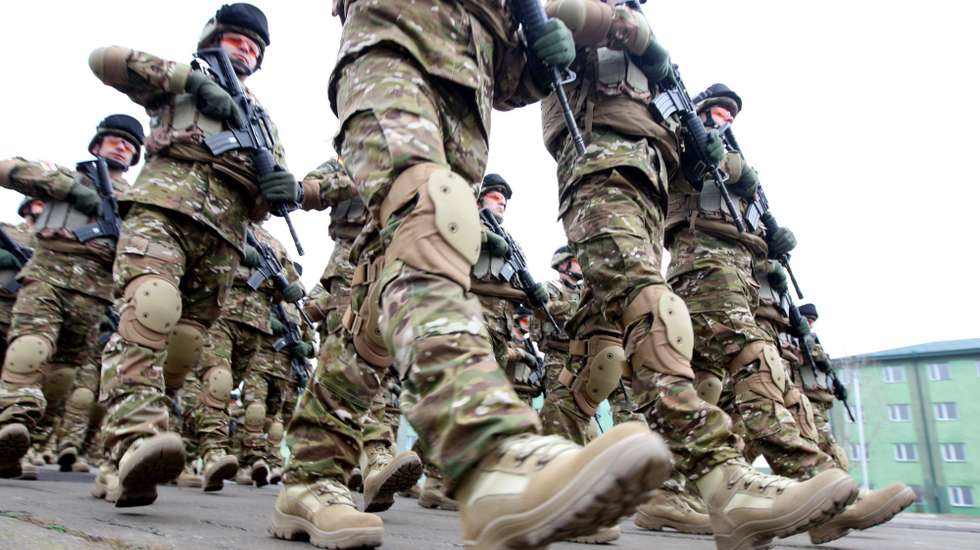 epa04530893 Georgian soldiers march at the military base of Vaziani outside Tbilisi during a farewell ceremony marking their departure to Afghanistan, in Tbilisi, Georgia, 16 December 2014. Georgian militaries will take part in the NATO peace support mission in Afghanistan.  EPA/ZURAB KURTSIKIDZE