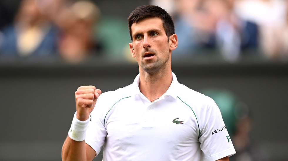 epa09334386 Novak Djokovic of Serbia reacts during his men's semi final match against Denis Shapovalov of Canada at the Wimbledon Championships in Wimbledon, Britain, 09 July 2021.  EPA/NEIL HALL   EDITORIAL USE ONLY