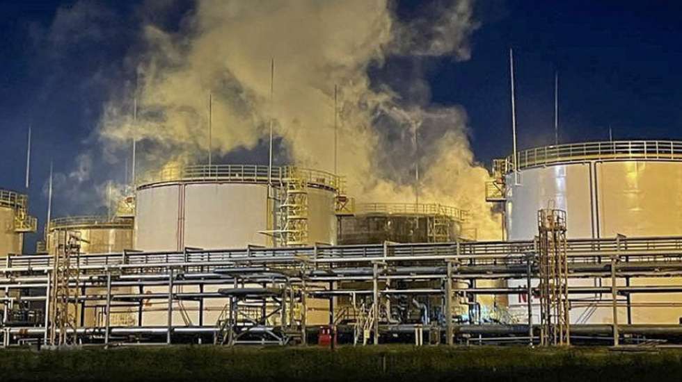 epa10607926 A handout photo made available by Krasnodar region governor's press service shows smoke rising from a fire site at an oil refinery in the southern Krasnodar region's Ilsky settlement, Russia, 04 May 2023. A tank with oil products caught fire at the refinery following a drone attack. A total of 167 people and 39 pieces of equipment were involved in extinguishing the fire which, at 04:20 Moscow time, was localized to an area of 400 sq.m. There were no dead or injured.  EPA/Krasnodar region governor's press service  HANDOUT EDITORIAL USE ONLY/NO SALES