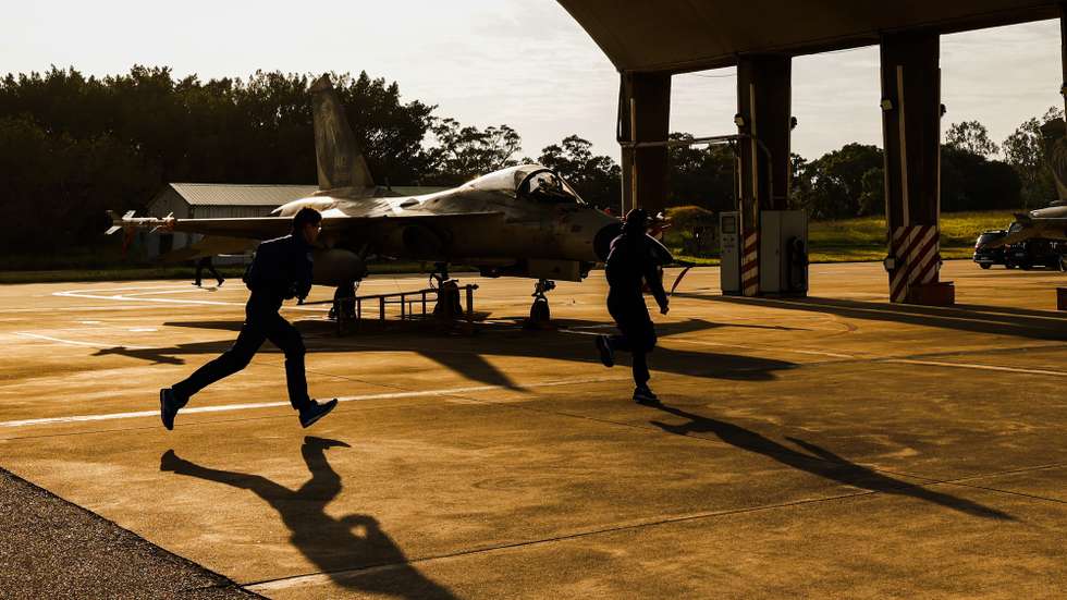 epa11810855 Taiwan Air Force personnel and pilots of Indigenous Defense Fighter Jets (IDF) conduct a flight inspection during a drill inside an airbase in Taichung, Taiwan, 07 January 2025. Taiwanese President William Lai (Lai Cheng-te) pledged in his New Year speech to boost Taiwan’s defense budget amidst the rising tension from China.  EPA/RITCHIE B. TONGO