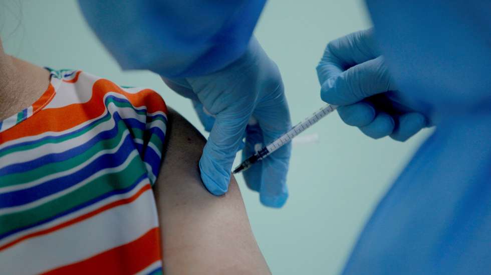 epa09051606 An older adult is vaccinated against covid-19 during the start of phase two of the covid-19 vaccination program, in San Miguelito, Panama, 04 March 2021. In one of the districts of the country most affected by the new coronavirus, the health authorities are initiating phase two of the covid-19 vaccination programme, which initially covers the population over 60 years of age, following the arrival on Tuesday of a fourth batch of vaccines with 87,550 doses of Pfizer.  EPA/Miguel Lemos