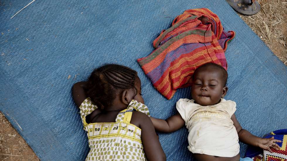 epa09002082 Children sleep in an Internally Displaced Peoples (IDP) camp in Liton, Central African Republic, 10 February 2021. Cases of malnutrition, malaria and diarrhea have increased in the health center located by the site. More cases of children coming with multiple diseases at once are also noticeable. The Central African Republic has extended the current state of emergency for six months as the fight against a coalition of rebel groups continues. The IDPs have been given food aid by the organisation PAM once, and non-food items by Action Contre la Faim. More international organisations are waiting for possibilities of actions but even though Liton is only 22 kilometers away from Bangui they haven't been able to reach due to security concerns. Some 2,559 people have been displaced in the village of Liton, in the Central African Republic since mid-January.  More than 240,000 people have left their homes, to take refuge in neighbouring countries, or inside the Central African Republic since 15 December 2020 according to the United Nations Office for the Coordination of Humanitarian Affairs (OCHA).  EPA/ADRIENNE SURPRENANT
