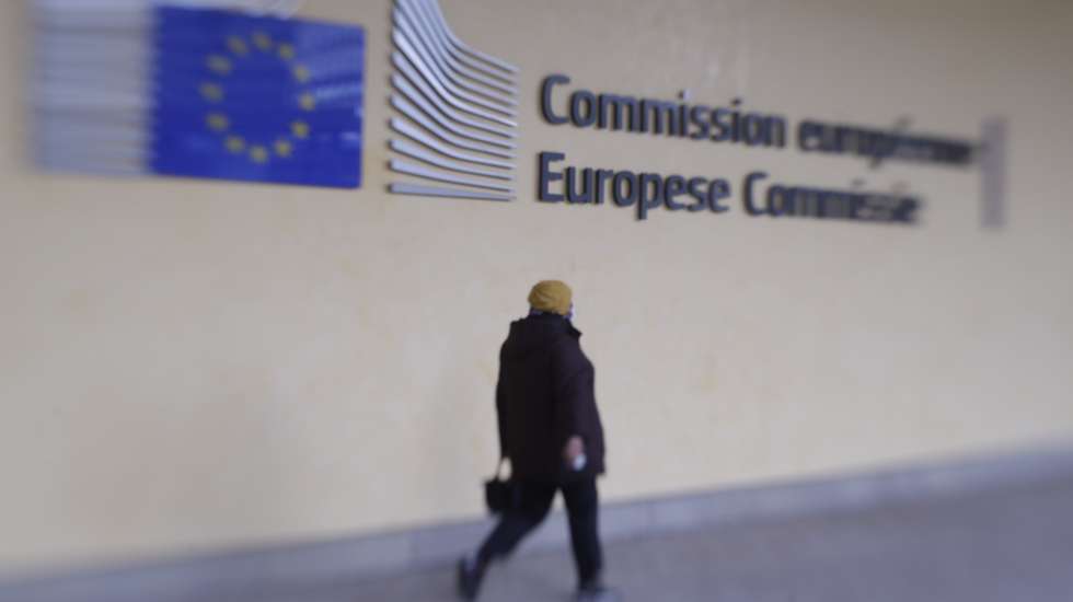 epa08795886 A picture taken with Lensbaby shows a person walking in front of European Commission headquarters in Brussels, Belgium, 03 November 2020.  EPA/OLIVIER HOSLET Taken with Lensbaby