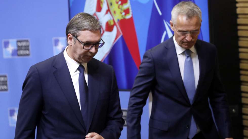 epa10125712 NATO Secretary General Jens Stoltenberg (R) and the President of the Republic of Serbia Aleksandar Vucic leave after they give a joint press conference following their meeting at the Alliance headquarters in Brussels, Belgium, 17 August 2022.  EPA/OLIVIER HOSLET