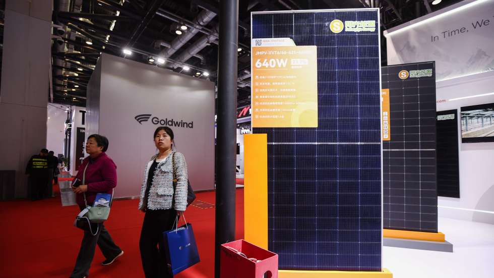 epa12848003 Visitor walk past Solar photovoltaic panels during the 2026 China International Hydrogen Congress and Expo (CIHC) in Beijing, China, 25 March 2026. 2026 China International Hydrogen Congress and Expo runs from 25 to 27 March 2026.  EPA/WU HAO
