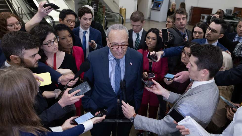 epa11135051 US Senate Majority Leader Chuck Schumer (C) speaks to members of the news media before the Senate failed to advance a bipartisan immigration and foreign aid bill, on Capitol Hill in Washington, DC, USA, 07 February 2024. The Senate failed to advance a 118 billion USD immigration and foreign aid bill that was the result of months of bipartisan negotiations to increase US border security and provide aide to Ukraine, Israel, Taiwan and others. The Senate will next vote on an alternative bill that only includes foreign aid and leaves out a border deal that had been a source of contention between Democrats and far-right Republicans supporting former US President Donald J. Trump.  EPA/MICHAEL REYNOLDS