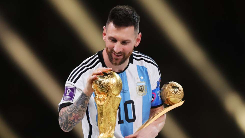 epa13202782 (FILE) - Lionel Messi of Argentina touches the World Cup trophy as he passes it after winning the golden ball award during the awards ceremony after the FIFA World Cup 2022 Final between Argentina and France at Lusail stadium, Lusail, Qatar, 18 December 2022 (Reissued 31 August 2026). Lionel Messi announed his retirement from international soccer on 31 August 2026.  EPA/FRIEDEMANN VOGEL