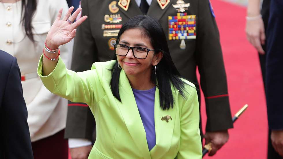 epa12652216 The acting president of Venezuela, Delcy Rodriguez, waves before presenting a report to Parliament in Caracas, Venezuela, 15 January 2026. Rodriguez delivered the report as Venezuelan President Nicolas Maduro is currently detained in the United States along with his wife, Cilia Flores, after they were captured during a US military operation on 03 January 2026.  EPA/RONALD PENA R