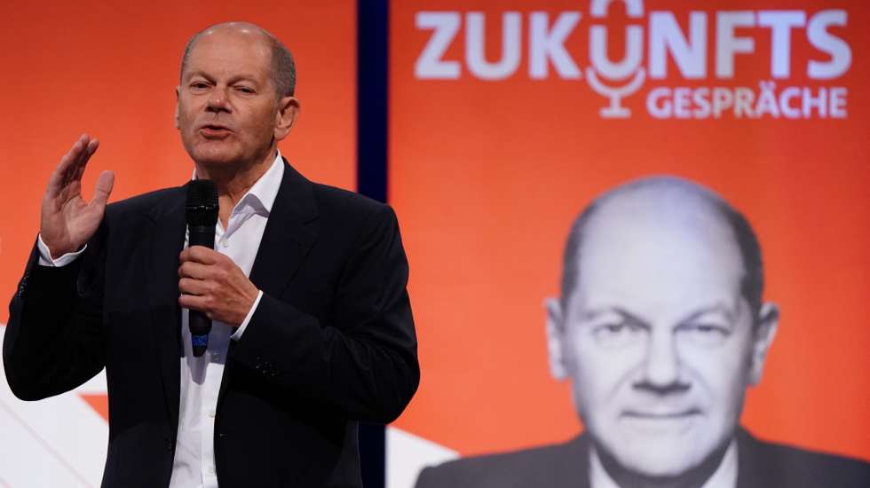 epa09416774 German Minister of Finance and Social Democratic Party (SPD) top candidate for the federal elections Olaf Scholz gestures as he attends the event ‘future talks’ in Berlin, Germany, 16 August 2021. German Minister of Finance and Social Democratic Party (SPD) top candidate for the federal elections Olaf Scholz attended a discussion round with citizens as part of the Social Democrats campaigning for the federal elections. That take place on 26 September 2021.  EPA/CLEMENS BILAN