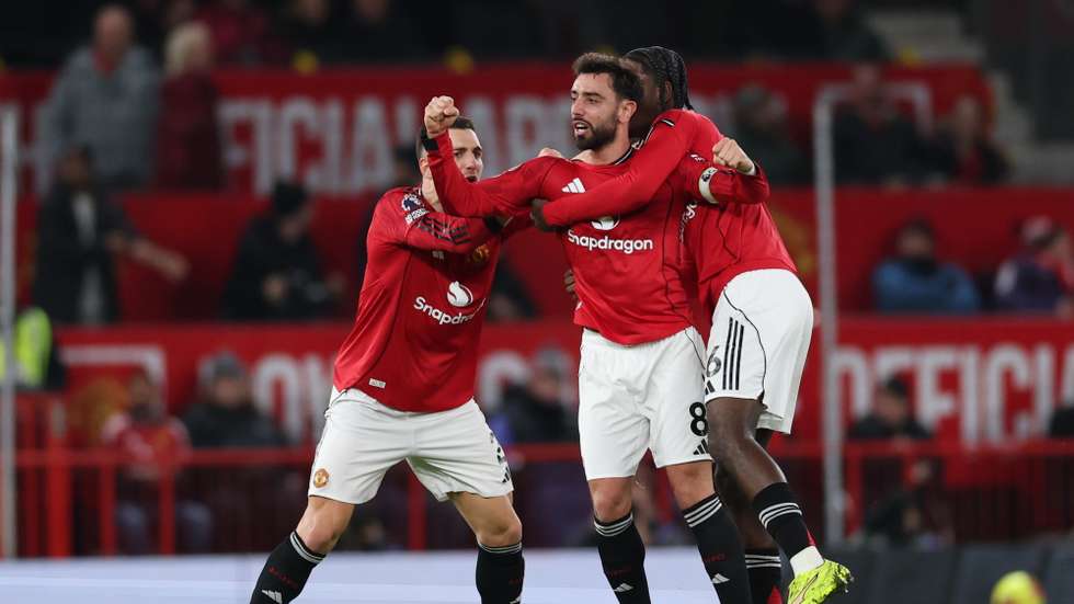 epa12595225 Bruno Fernandes of Manchester United (C) celebrates with his teammates after scoring the 3-3 goal during the English Premier League match between Manchester United and AFC Bournemouth, in Manchester, Britain, 15 December 2025.  EPA/ADAM VAUGHAN EDITORIAL USE ONLY. No use with unauthorized audio, video, data, fixture lists, club/league logos, 'live' services or NFTs. Online in-match use limited to 120 images, no video emulation. No use in betting, games or single club/league/player publications.