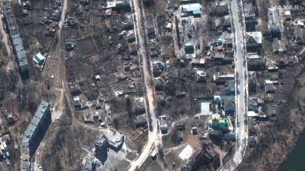 epa10189346 A handout satellite image made available by Maxar Technologies shows damaged buildings in Izyum, Ukraine, 24 March 2022 (issued 17 September 2022). According to statements from Ukraine President Volodymyr Zelensky, bodies found in a mass burial site near Izyum, an area recently taken back from Russian forces, show signs of torture. Governor of Kharkiv Oblast Oleg Synegubov stated that civilians were among the dead, and some of the more than 440 bodies found buried at the site had their hands bound behind their backs.  EPA/MAXAR TECHNOLOGIES HANDOUT -- MANDATORY CREDIT: SATELLITE IMAGE 2022 MAXAR TECHNOLOGIES -- THE WATERMARK MAY NOT BE REMOVED/CROPPED -- HANDOUT EDITORIAL USE ONLY/NO SALES