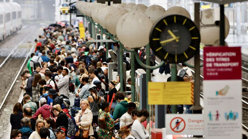 epaselect epa11496923 Stranded passengers wait inside Gare du Nord station in Paris, France, 26 July 2024. France's high speed rail network TGV was severely disrupted on 26 July following a 'massive attack', according to train operator SNCF, just hours before the opening ceremony of the Paris 2024 Olympic games. French Transport Minister Patrice Vergriete condemned 'these criminal actions' saying that they would 'seriously disrupt traffic' until this weekend. Around 800,000 passengers are expected to be affected over the weekend.  EPA/RITCHIE B. TONGO