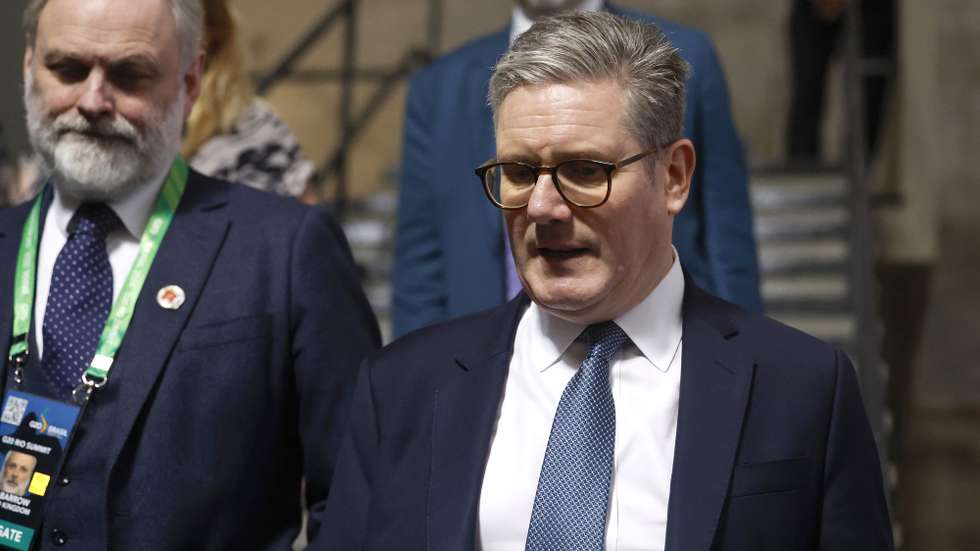 epa11729428 British Prime Minister Keir Starmer (R) leaves a meeting during the second day of the G20 Summit of Heads of State, in Rio de Janeiro, Brazil, 19 November 2024. The G20 Summit brings together leaders from 55 nations and organizations on 18 and 19 November at the Museum of Modern Art in Rio de Janeiro.  EPA/ANTONIO LACERDA