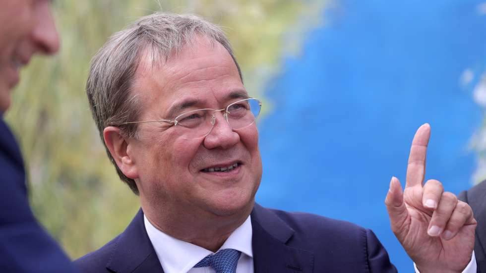 epa09422009 German Christian Democratic Union (CDU) leader Armin Laschet reacts as he attends the inauguration of the pumping station in Oberhausen, Germany, 20 August 2021. The pumping Station is part of the reconstruction of the Emscher system.  EPA/FRIEDEMANN VOGEL