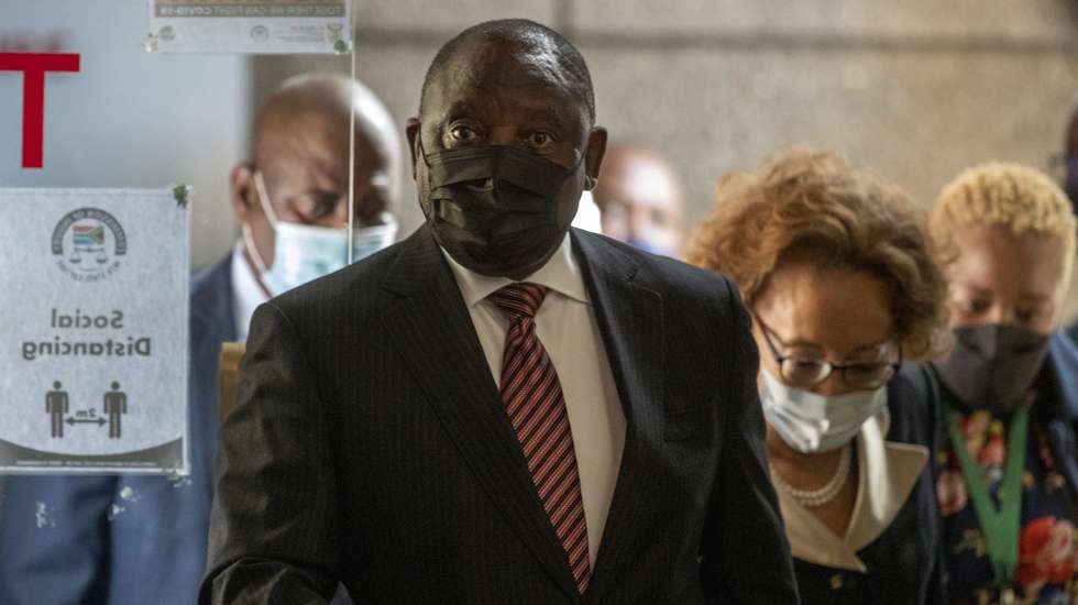 epa09164867 South African President Cyril Ramaphosa (front) arrives to appear on behalf of the ruling party African National Congress (ANC) at the Zondo Commission of Inquiry in Johannesburg Johannesburg, South Africa, 28 April 2021. The Zondo Commission was set up by former President Jacob Zuma to investigate state capture and corruption in the country.  EPA/THEMBA HADEBE / POOL