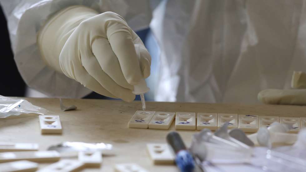 epa08836961 Indian medical personnel collects swab samples for coronavirus COVID-19 Rapid Antigen detection tests outside the zonal Hospital at Dharamsala, India, 23 November 2020. In an attempt to counter the spread of the SARS-CoV-2 coronavirus, which causes the COVID-19 disease many state governments including Gujarat, Maharastra, Himachal Pradesh, Madhya Pradesh imposed night curfew and other travel related restrictions as India has the second highest total of confirmed COVID-19 cases in world, as Indian tally cross nine million cases, only behind the United States.  EPA/SANJAY BAID