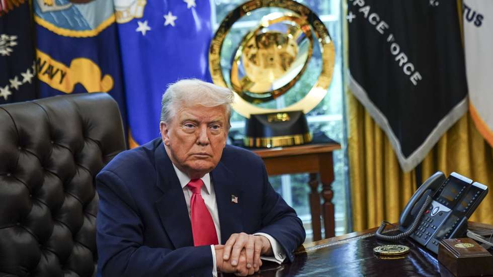epa12300753 US President Donald Trump looks on during an event marking the 90th anniversary of the Social Security Act, in the Oval Office at the White House, Washington, DC, USA, 14 August 2025. President Trump also delivered remarks on the federal crime crackdown in DC, and his trip to Anchorage to meet with Russian President Vladimir Putin.  EPA/WILL OLIVER / POOL