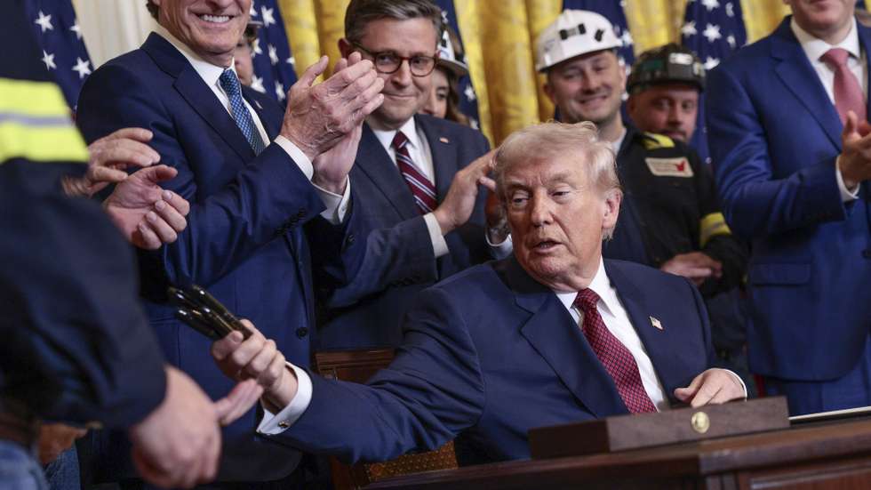 epa12729160 US President Donald J. Trump gives the pens away as souvenirs after he signed an executive order during the Champion of Coal Event in the East Room of the White House in Washington, DC, USA, 11 February 2026. US President Donald Trump's executive order directs the US military to purchase electricity from coal-fired power plants. For his efforts on behalf of the coal industry, US President Trump was awarded the 'Undisputed Champion of Coal' award from lobbyists of the Washington Coal Club.  EPA/SHAWN THEW / POOL