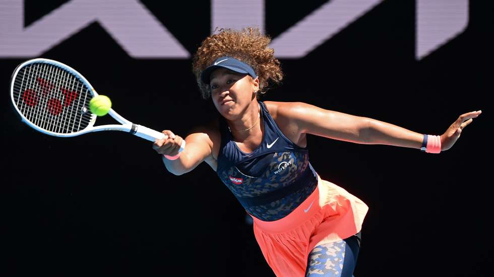 epa09020220 Naomi Osaka of Japan in action during her Women's singles semifinals match against Serena Williams of the United States on Day 11 of the Australian Open Grand Slam tennis tournament at Melbourne Park in Melbourne, Australia, 18 February 2021.  EPA/DEAN LEWINS AUSTRALIA AND NEW ZEALAND OUT